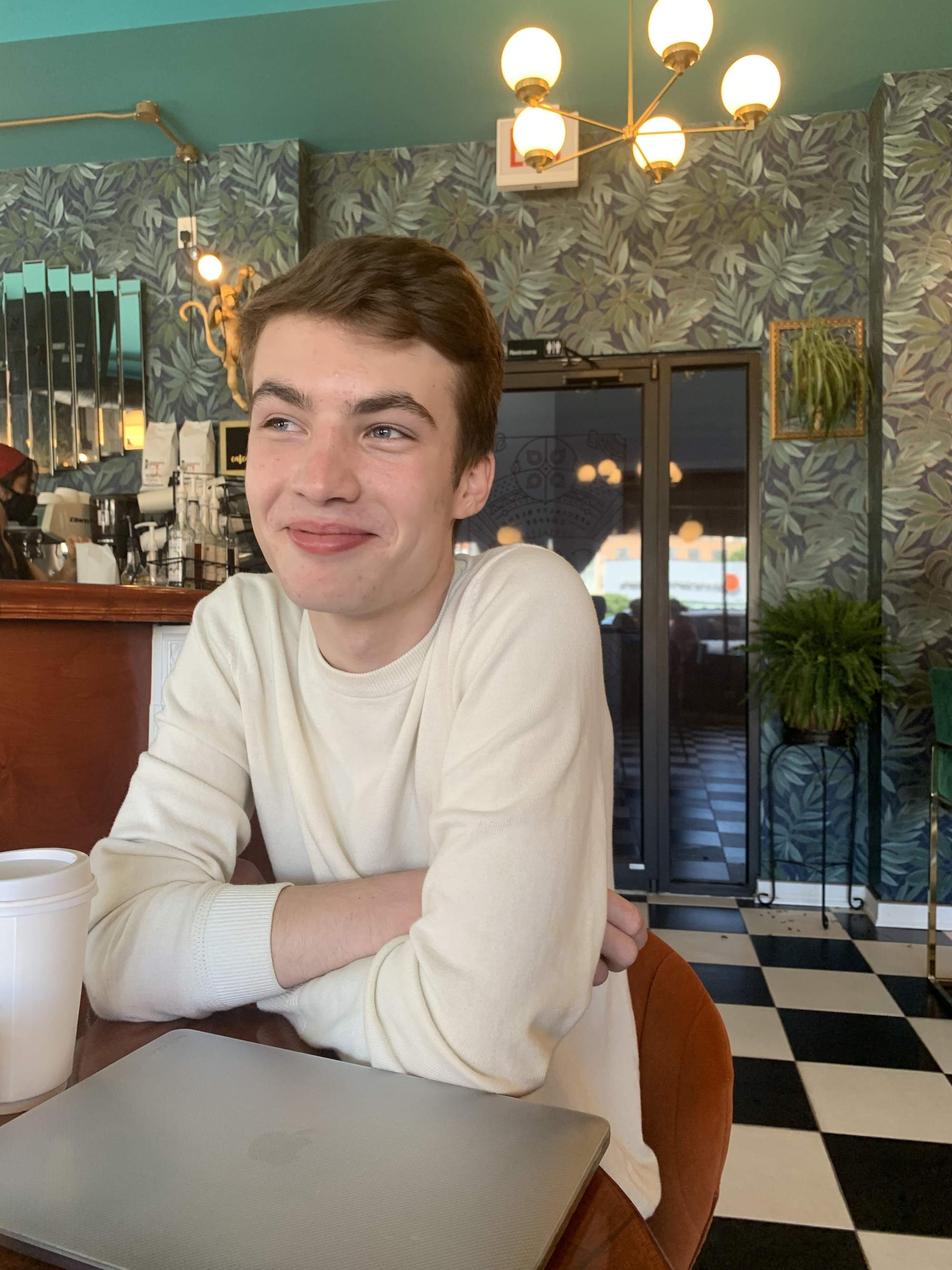 Me in a coffee shop looking up and past the camera